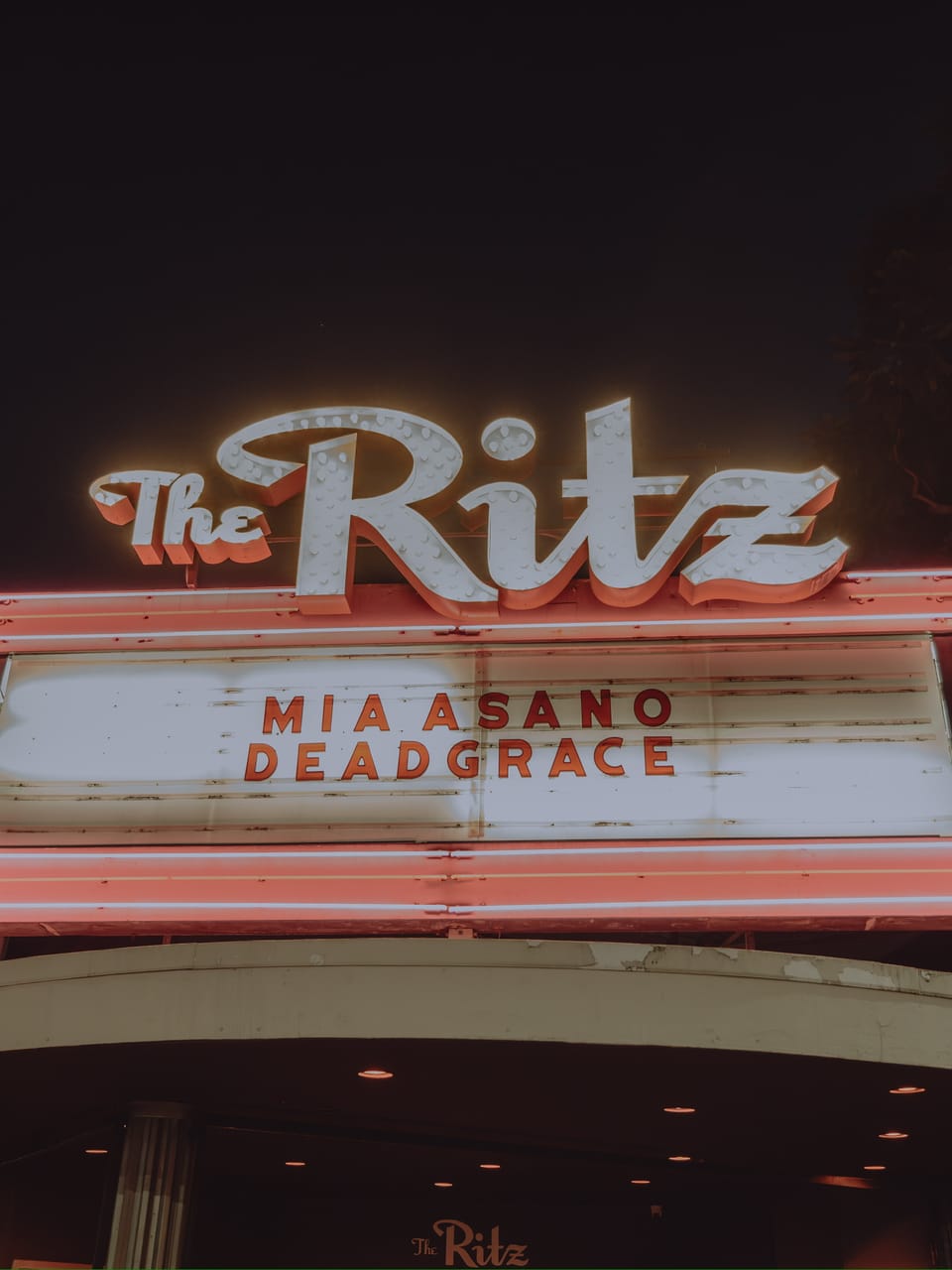 The Ritz marquee on South First Street in San Jose lit up at night, its neon sign reading MIA ASANO and DEADGRACE